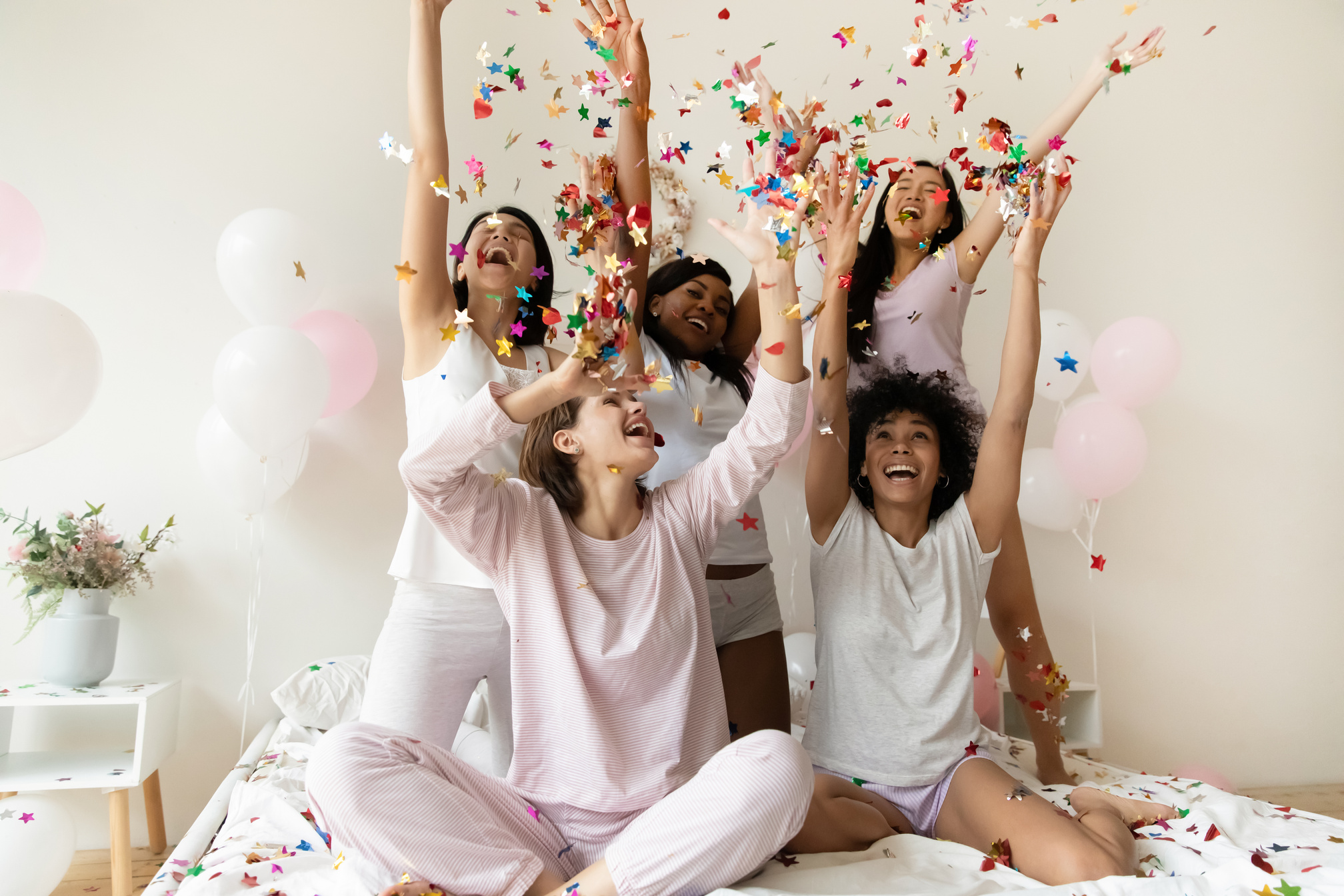 Happy girls have fun dancing at home bridal shower